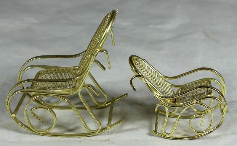 Pair of brass rocking chairs