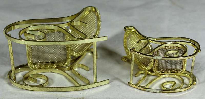Pair of brass rocking chairs