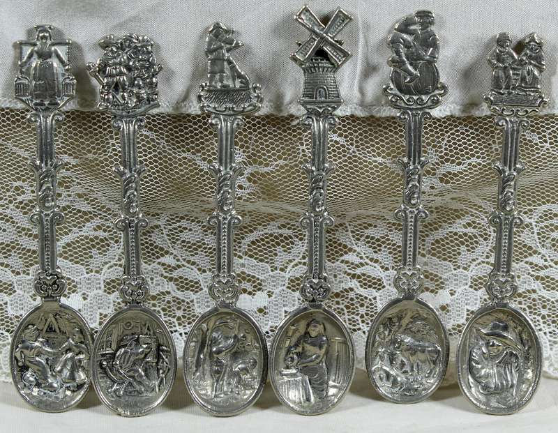 Set of 6 high relief Dutch salt spoons