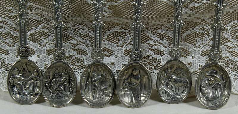Set of 6 high relief Dutch salt spoons