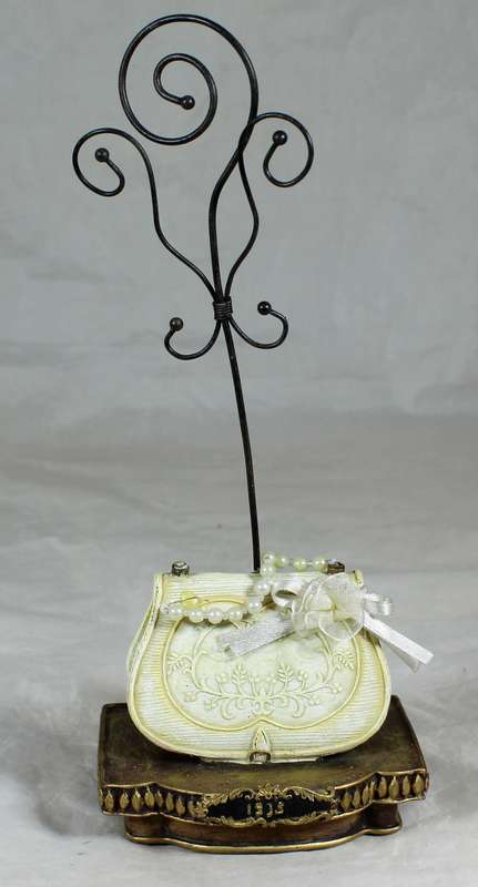 Molded bag with faux pearls jewelry stand