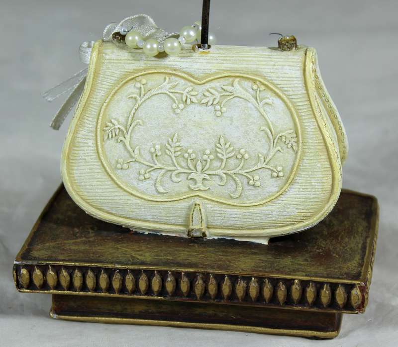 Molded bag with faux pearls jewelry stand