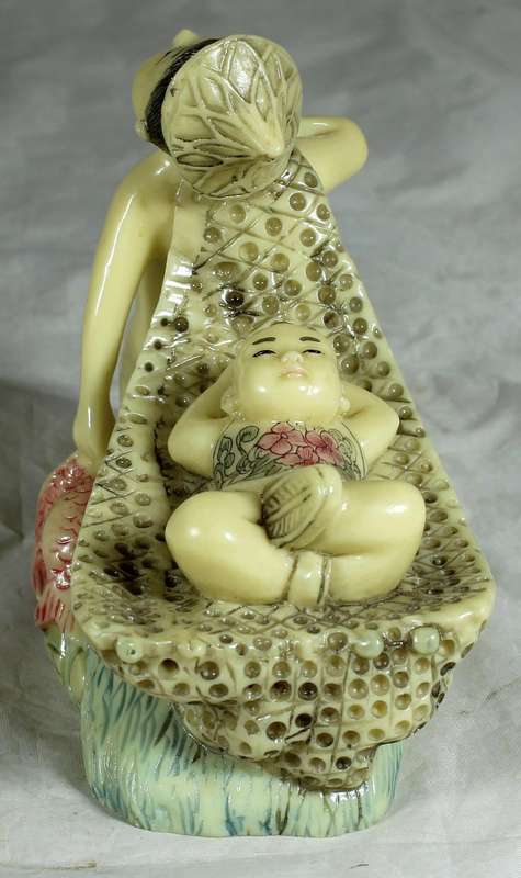 Japanese Netsuke figure - Man holding fish and pulling baby - Resin