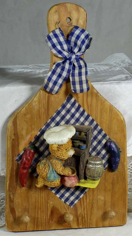 Wooden wall hanging with bear chef in blue