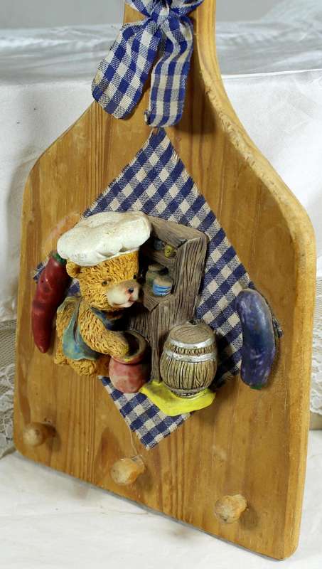 Wooden wall hanging with bear chef in blue