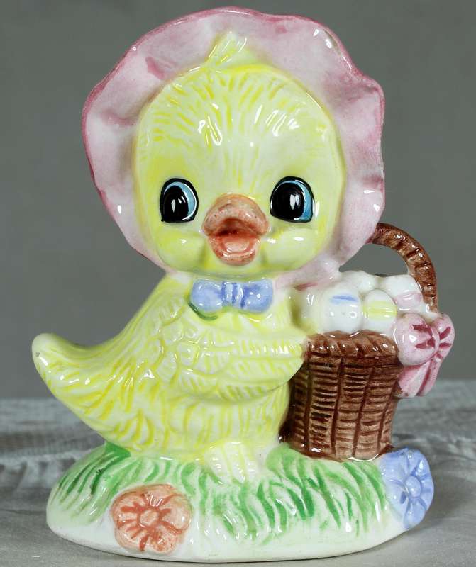 Mother hen with basket of eggs