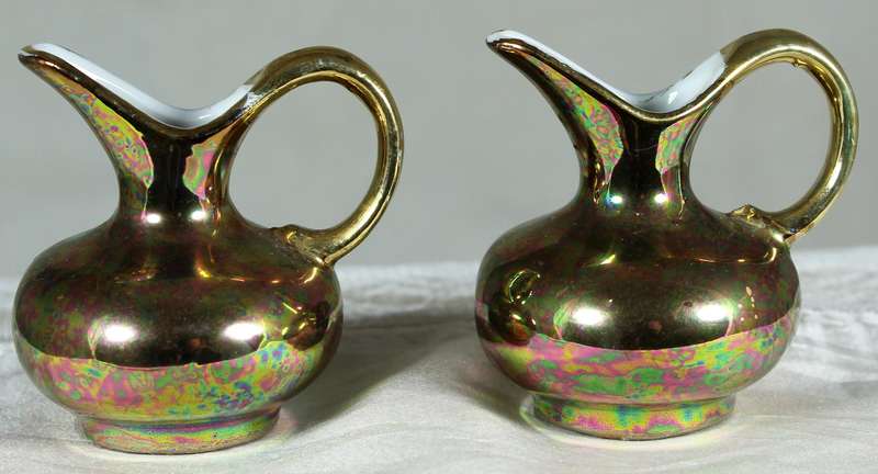 Miniature pair of golden covered pitchers