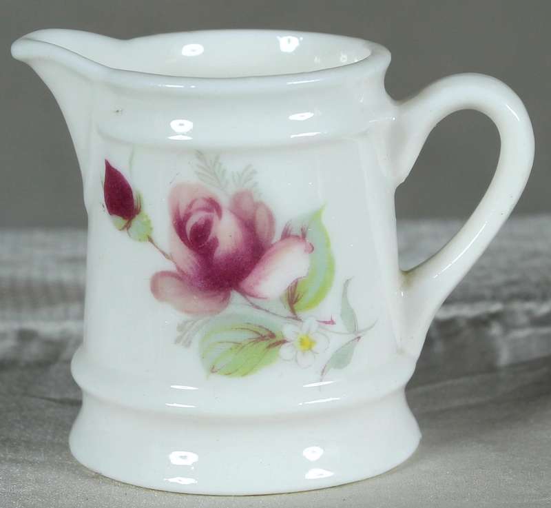 Miniature Tivoli pitcher with purple flowers
