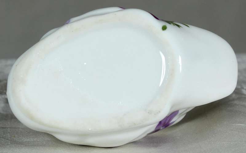 Miniature swan with purple violets