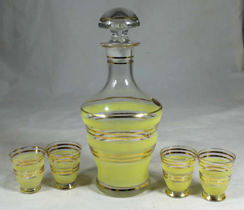 Decanter with yellow bars & four shot glasses