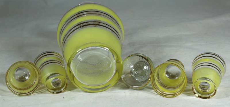 Decanter with yellow bars & four shot glasses