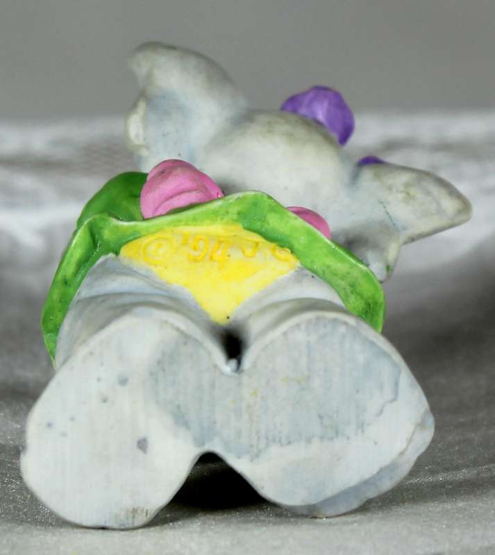 Miniature elephant playing a harmonica