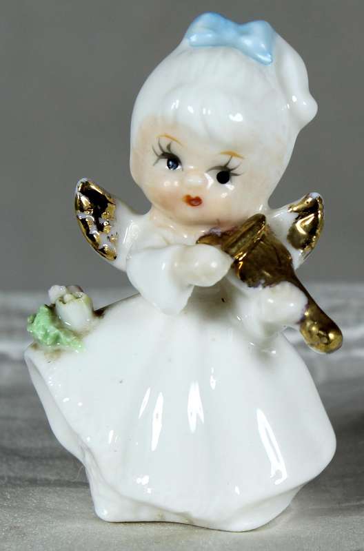 Miniature angel playing a violin