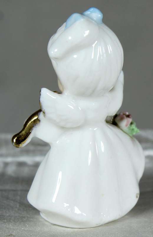 Miniature angel playing a violin