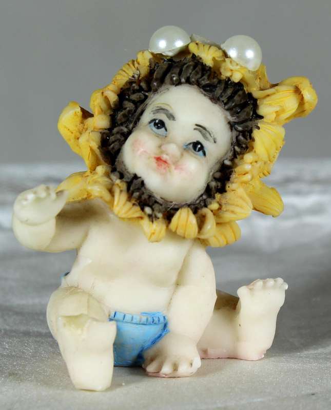 Miniature baby with sunflower cap