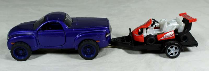 New Ray - Chevy SSR plus cart on trailer