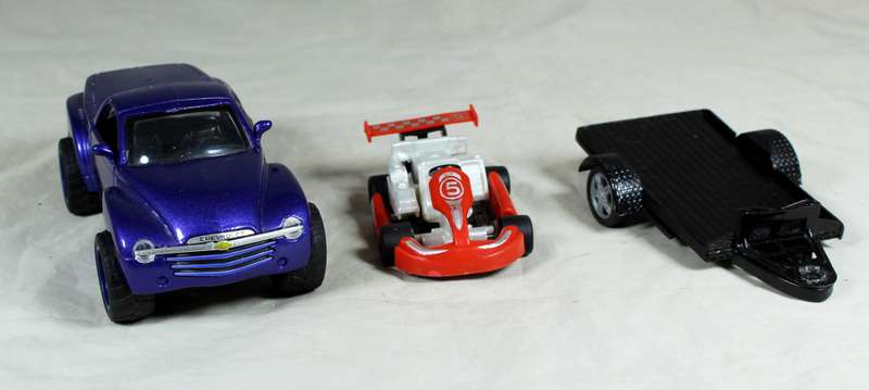 New Ray - Chevy SSR plus cart on trailer