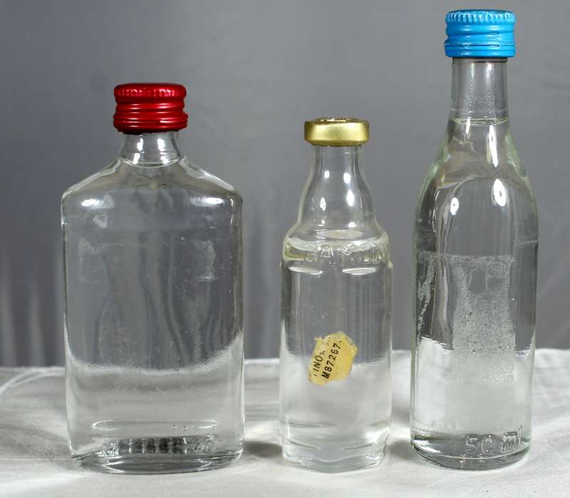 Empty liquor bottles - Trio of clear bottles