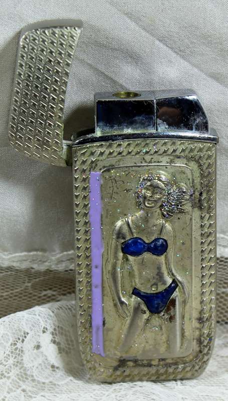 Vintage silver bikini lighter