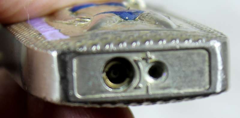 Vintage silver bikini lighter