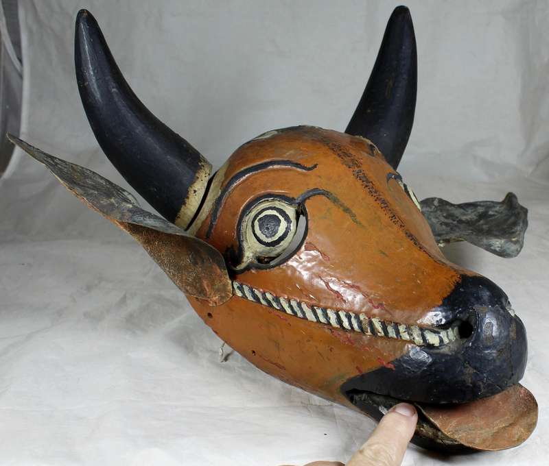 Carved wooden cows head painted