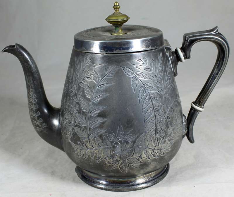 Silver plated tea kettle with extensive engravings