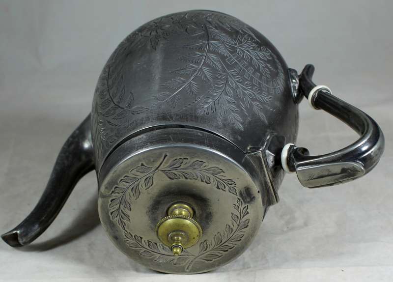 Silver plated tea kettle with extensive engravings