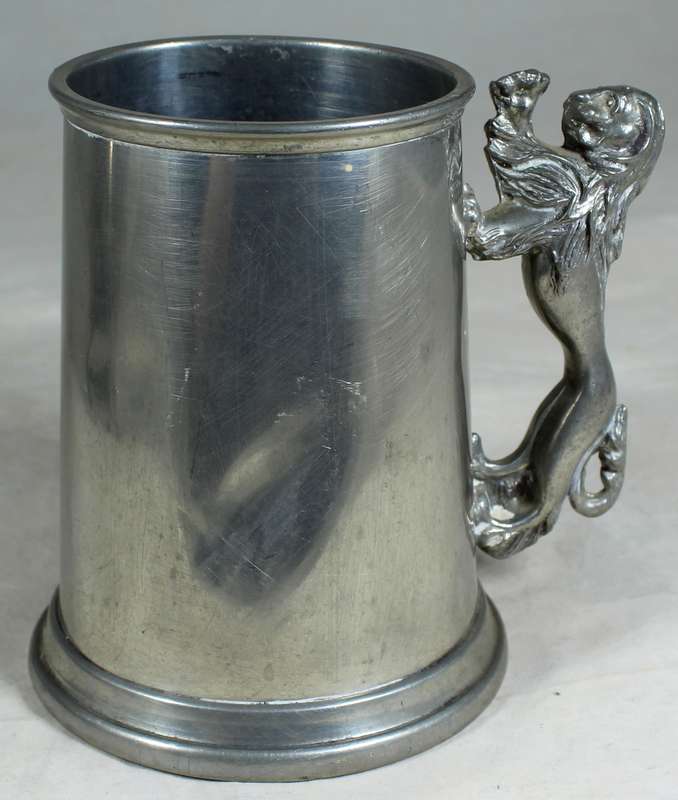 Metal tankard with lion handle