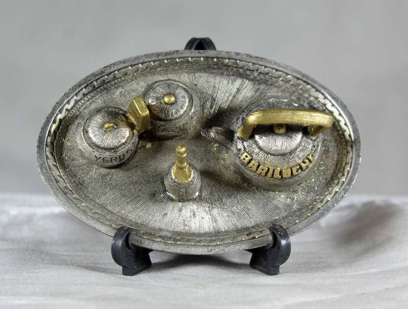 Miniature metal set of coffee pot items on a tray