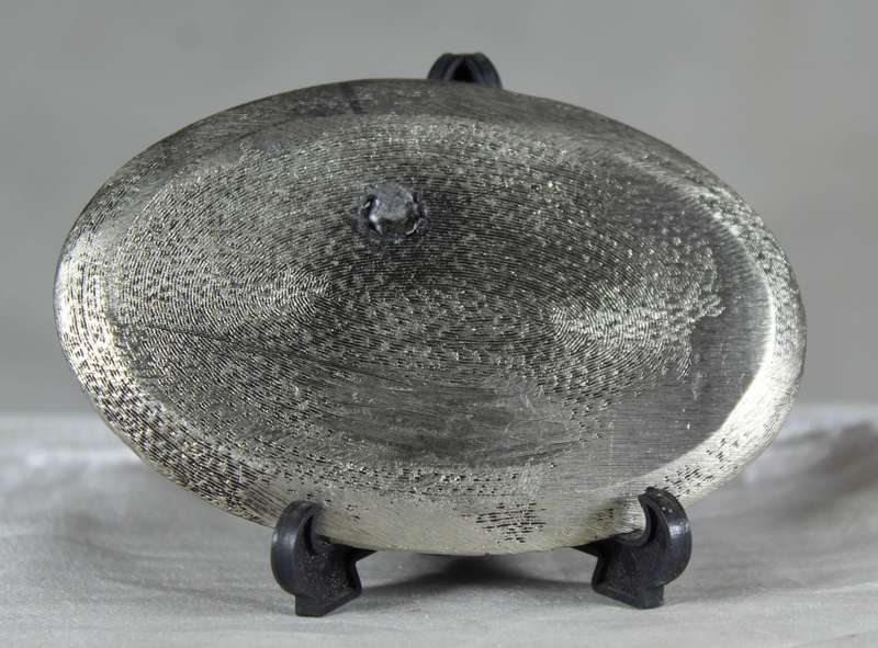 Miniature metal set of coffee pot items on a tray
