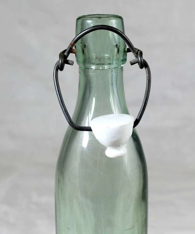 Vintage bottle with porcelain top