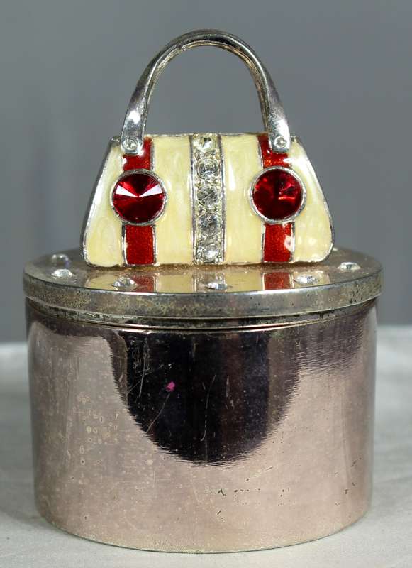 Small trinket holder with handbag on display
