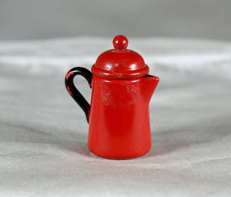 Miniature red painted metal coffee pot