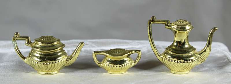 Trio of golden plated miniature pots