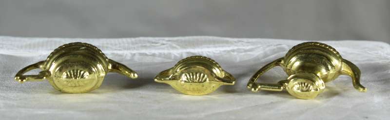 Trio of golden plated miniature pots