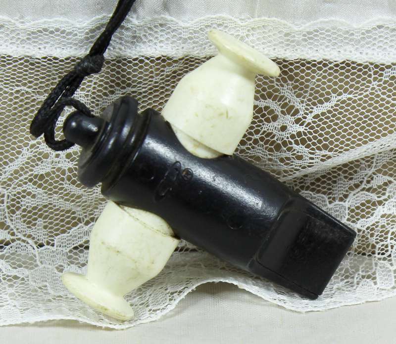 Plastic whistle in a canon shape