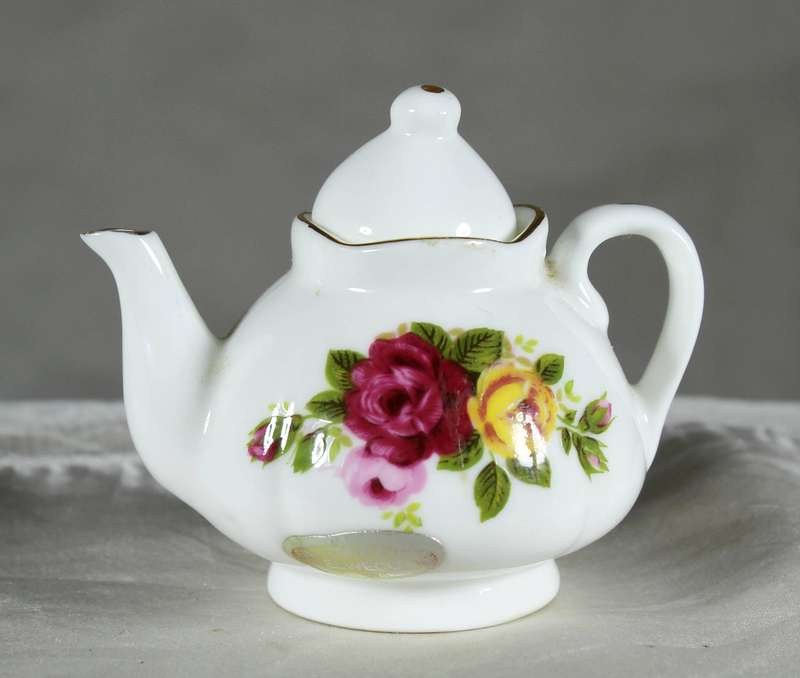Miniature porcelain kettle with roses