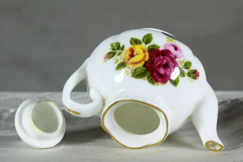 Miniature porcelain kettle with roses