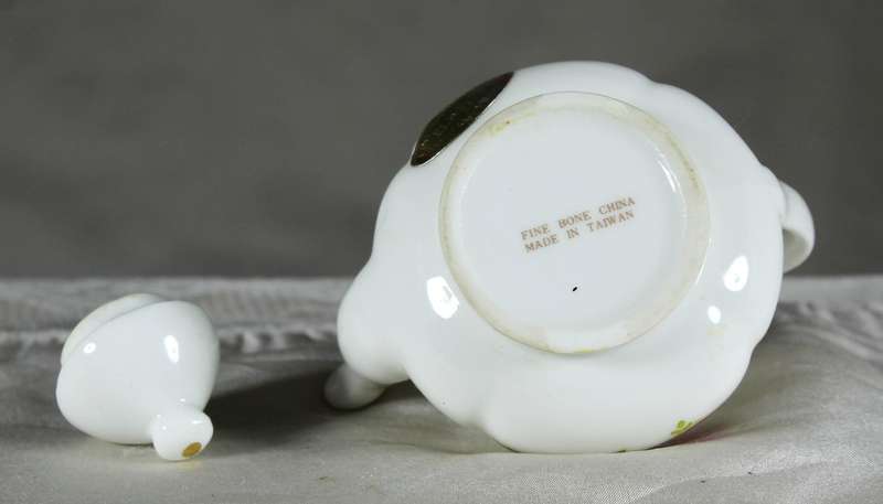 Miniature porcelain kettle with roses
