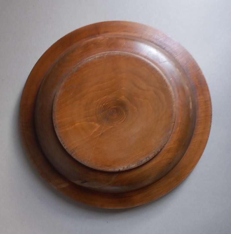 Vintage wooden decorative plate. Beautiful hand-carved