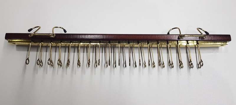 Necktie Rack: A wooden with gold tone Necktie rack with arms for 36 neckties.