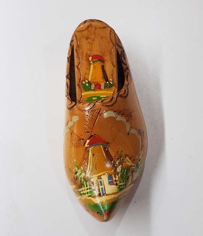 An Antique Handmade ornamental Dutch Wooden Clog with clothes brush wall hanging