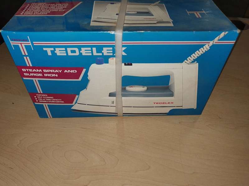 Antique Tedelex Iron still sealed in box.