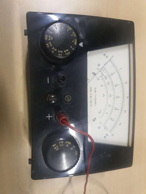 Antique multi-meter and battery tester.