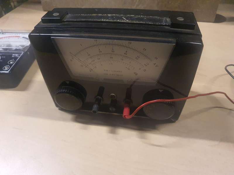 Antique multi-meter and battery tester.