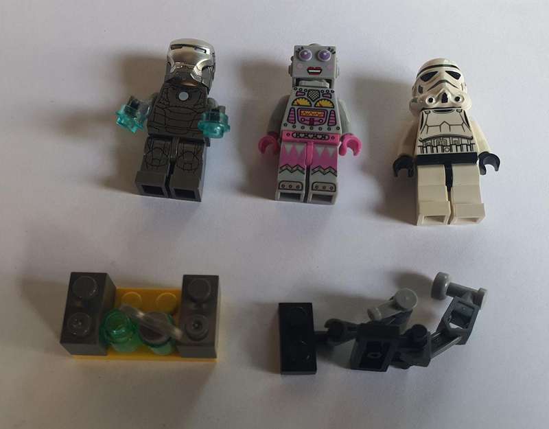 Lego Mini figurine 3 off with some Lego pieces