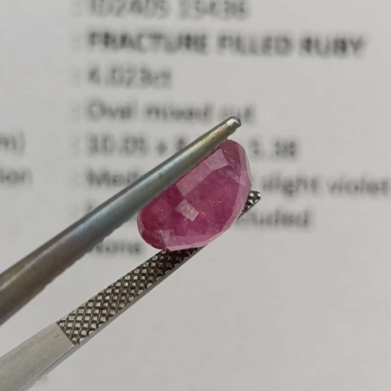 Fracture filled Ruby slight violet red Oval mixed cut 4.02 carat with Gemlab certificate