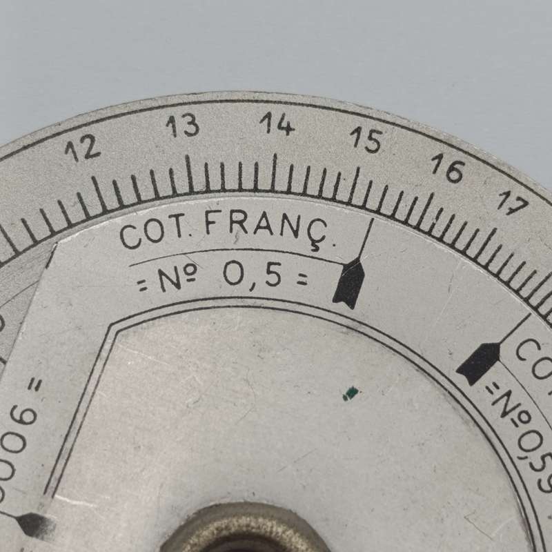 Vintage slide rule disk calculator