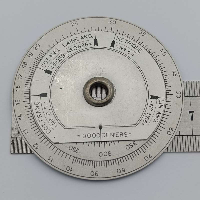 Vintage slide rule disk calculator