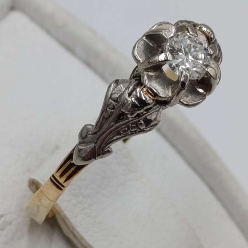Antique 18kt white and yellow gold ring with a 20 plus pointer diamond